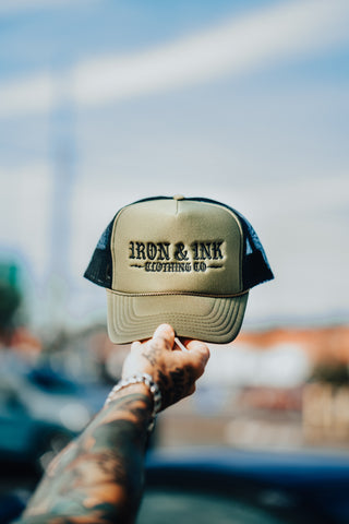 New "goth font" olive black trucker hat